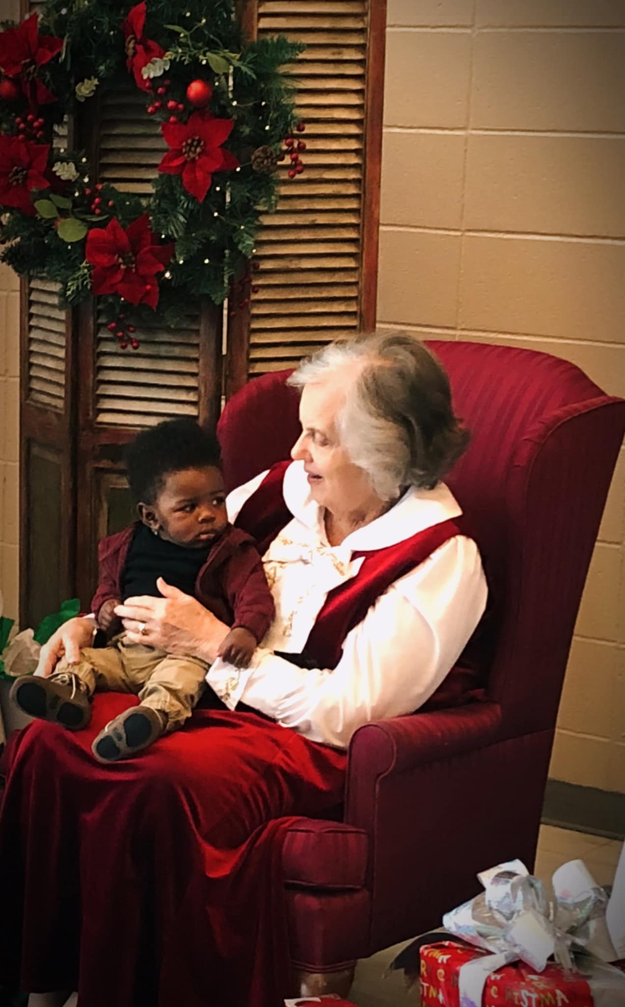 Mrs. Santa with a baby boy. 