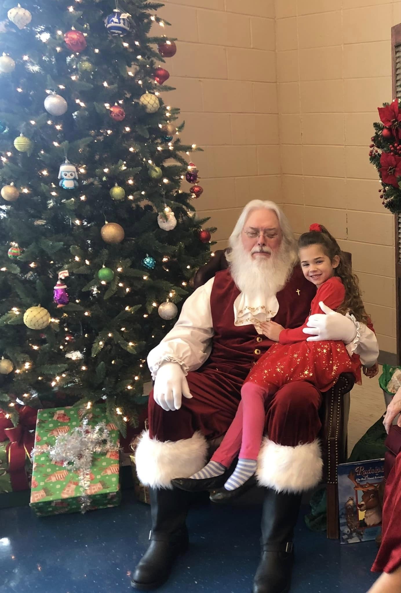 Little girl in Santa's lap. 
