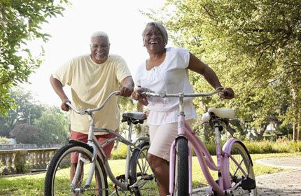 Man and woman standing beside bicycles